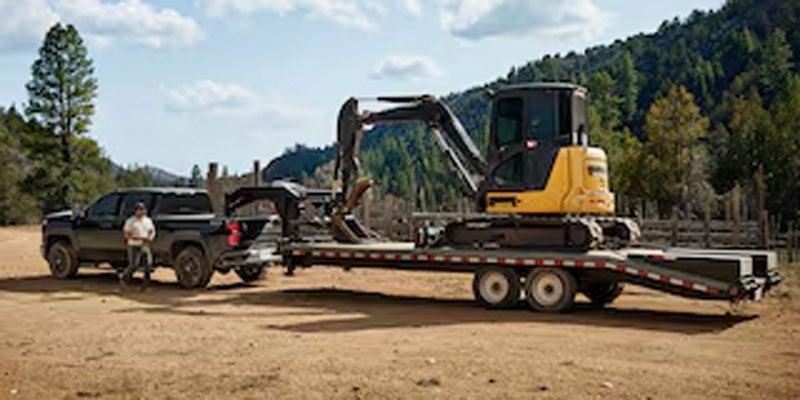 2026 Chevrolet Silverado 2500 hauling heavy equipment